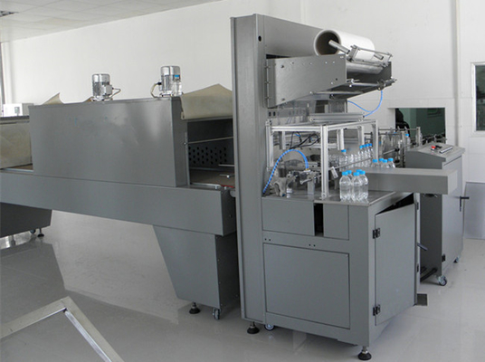 เครื่องบรรจุฟิล์มหดสำหรับโรงงานบรรจุน้ำฟิล์มหดเครื่อง CE ISO